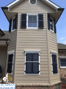 We install hurricane shutters in Covington LA like these aluminum colonial ones