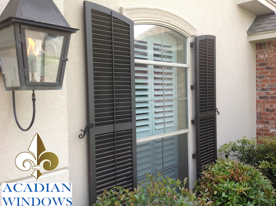 A Louisiana home that has hurricane shutters provided by Acadian Windows