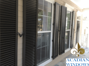 A local home featuring hurricane shutters for vinyl siding installed by Acadian Windows