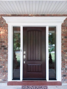 A customer's beautiful house after entrusting Acadian as their Foley doors company.