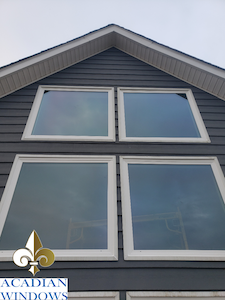 Our Saraland vinyl windows represented by an image of four windows on a house