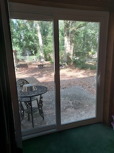 An example of the doors Chickasaw can expect from Acadian windows, represented by a sliding patio door.