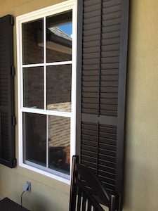 A customer example of the storm shutters Gulfport MS can expect from Acadian Windows.