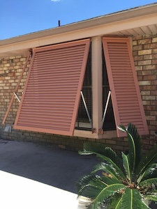 Acadian installs Bahama hurricane shutters near Gonzales like those pictured here