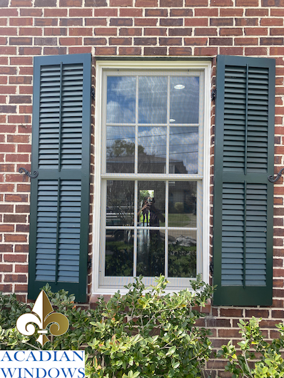 Acadian Windows installs shutters Long Beach trusts, like these seen on a brick house